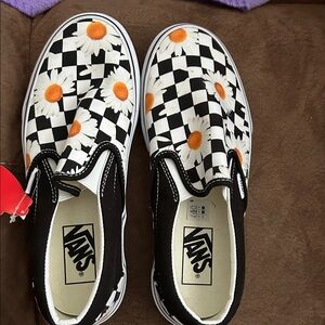 Vans Kids' Black and White Checkered Slip-On Sneakers with Orange Daisies